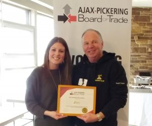 Nicole Gibson, Executive Director of the Ajax-Pickering Board of Trade presents Robert J. Weese of B2B Sales Connections a member recognition award for his support over the past 10 years.